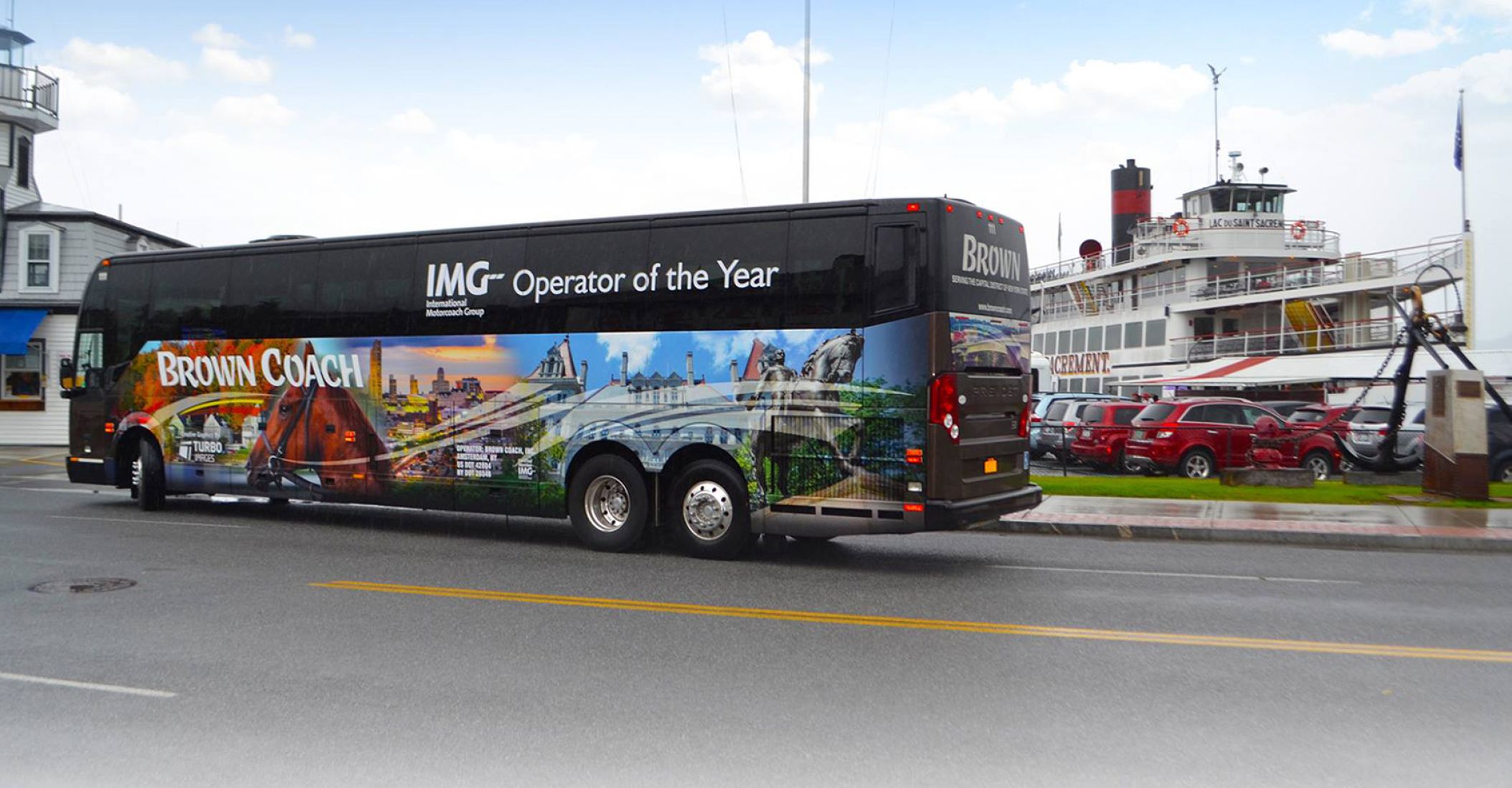 Brown Coach bus parked in front of a ship